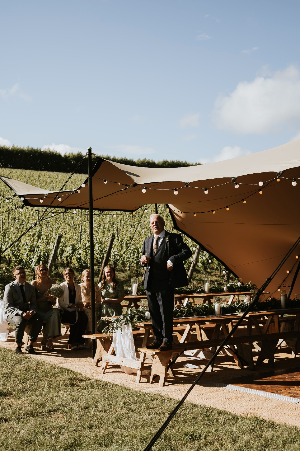 Small stretch tent over a vineyard ceremony
