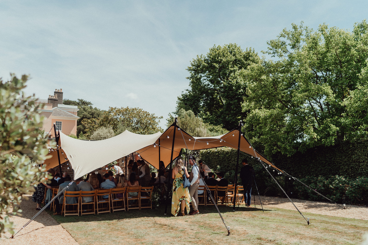 Small stretch tent set up for a garden ceremony