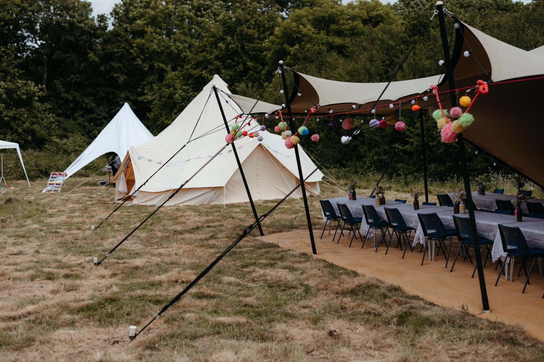 Small stretch tent alongside a bell tent