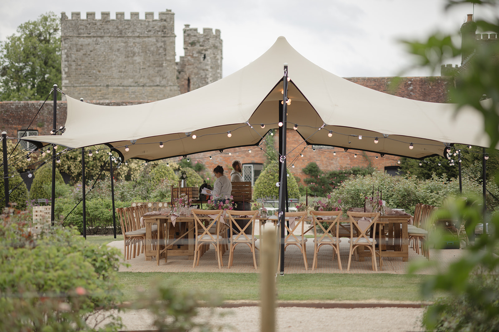 Small stretch tent in front of a castle