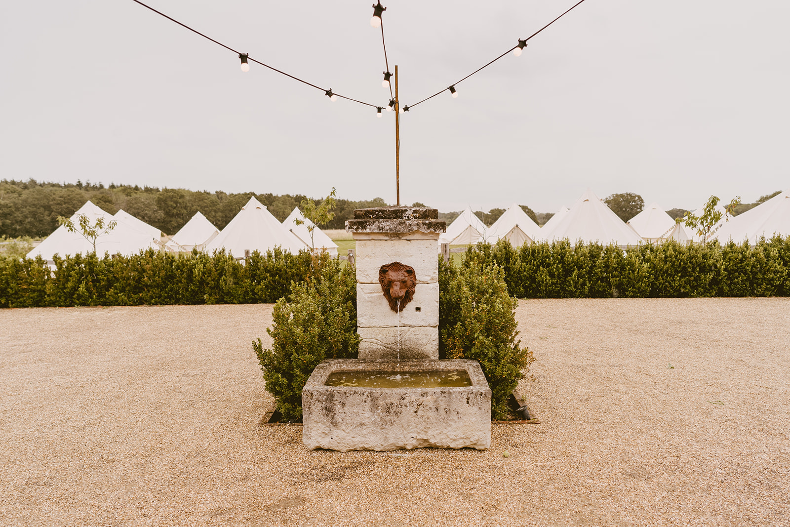 Courtyard fountain with bell tents beyond