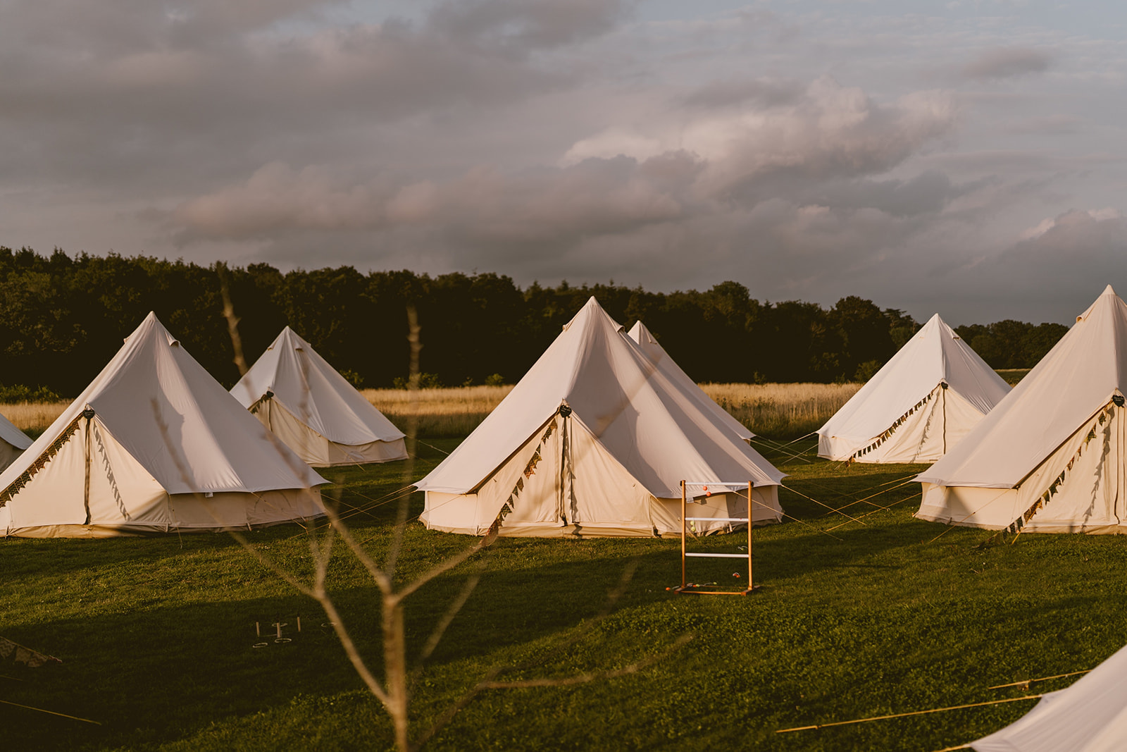 Bell tent village in golden hour light